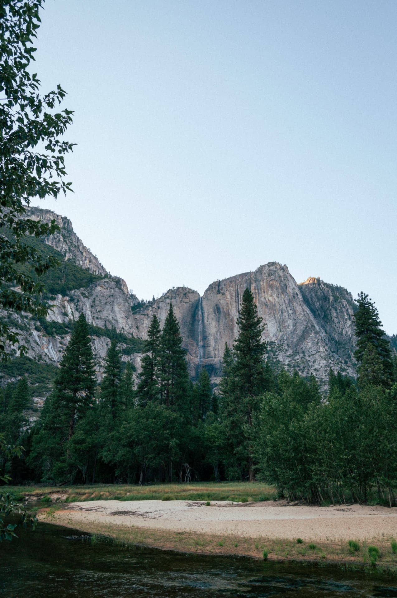 A large waterfall cascading down a granite mountain face in Yosemite. Photograph by Matt Schertzer.